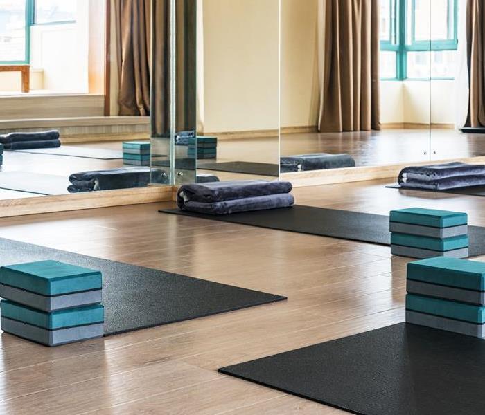 Yoga mats and blocks in an empty room.